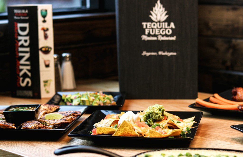 Queso fundido melted cheese dip with green onions in skillet at Tequila Fuego Mexican restaurant Longview WA